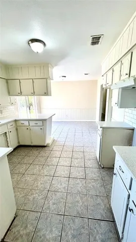 a view of a room with rack on the wall and a window