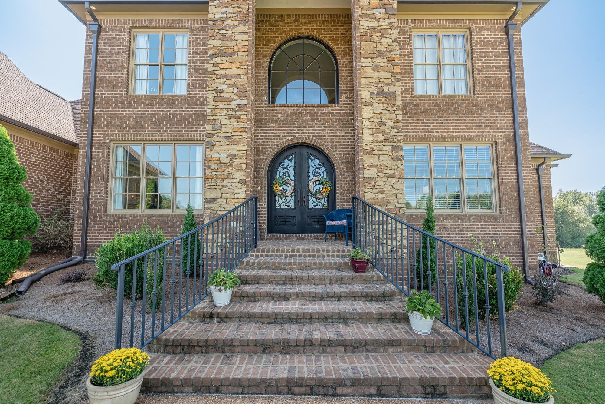 11949 Walnut Grove Road Eads, TN 38028 - Photo 2 of 2 a view of front door of house with stairs