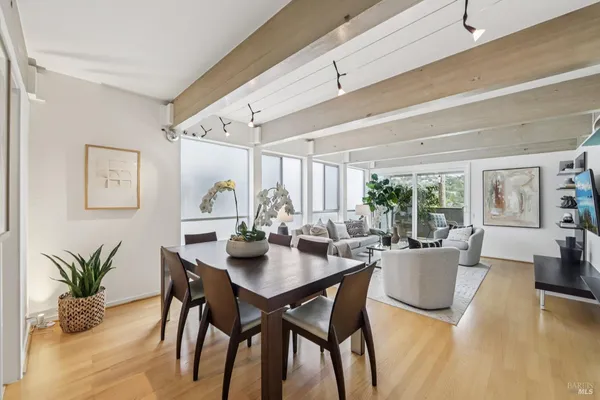 a kitchen with a sink cabinets and wooden floor