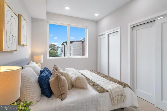 a bedroom with bed and a window