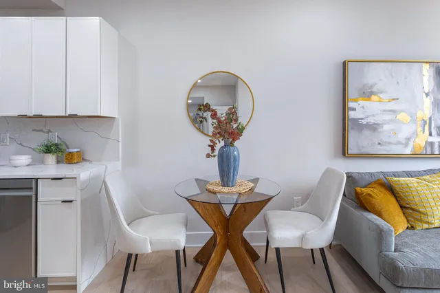 a view of a livingroom with furniture and a potted plant