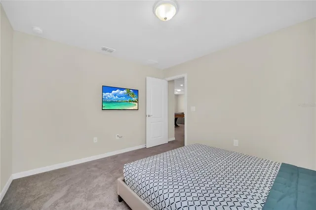 a view of a room with a flat screen tv