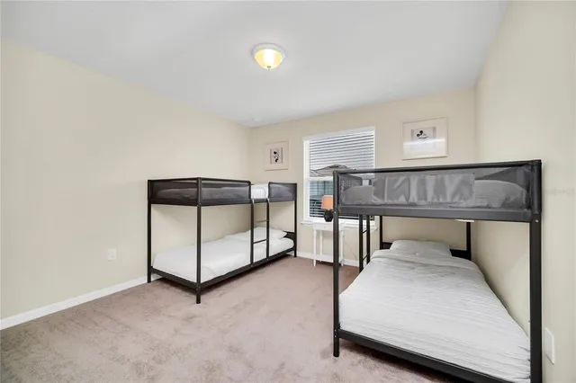 a bedroom with furniture and window