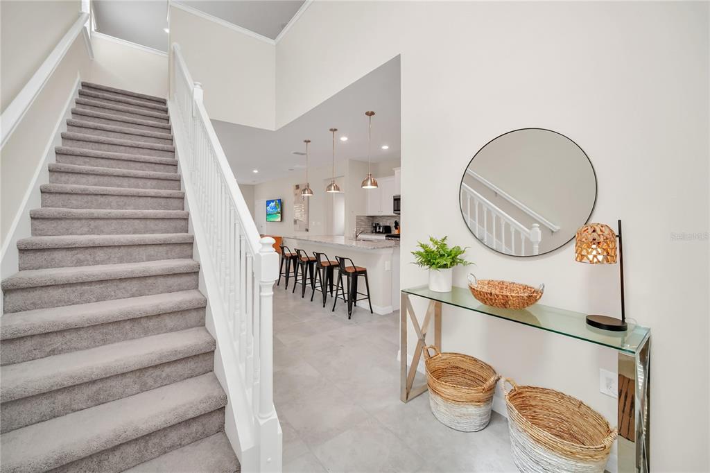 7196 Oakmoss Loop Davenport, FL 33837 - Photo 31 of 48 a view of dining room and hall with wooden floor