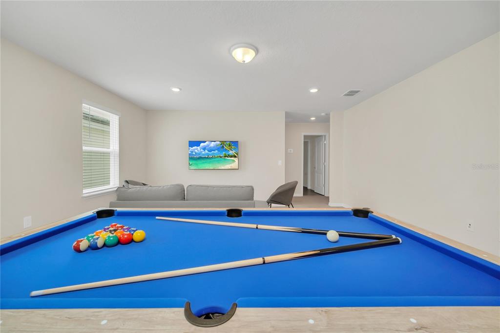 7196 Oakmoss Loop Davenport, FL 33837 - Photo 34 of 48 a room with pool table and windows