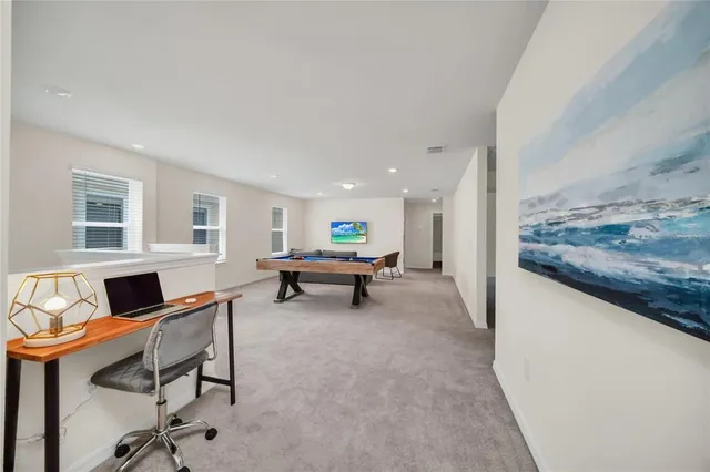 a living room with furniture and a table