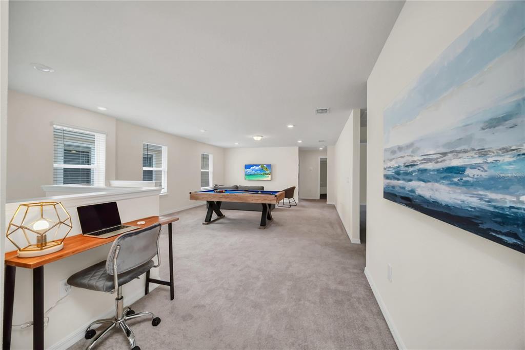 7196 Oakmoss Loop Davenport, FL 33837 - Photo 37 of 48 a living room with furniture and a table