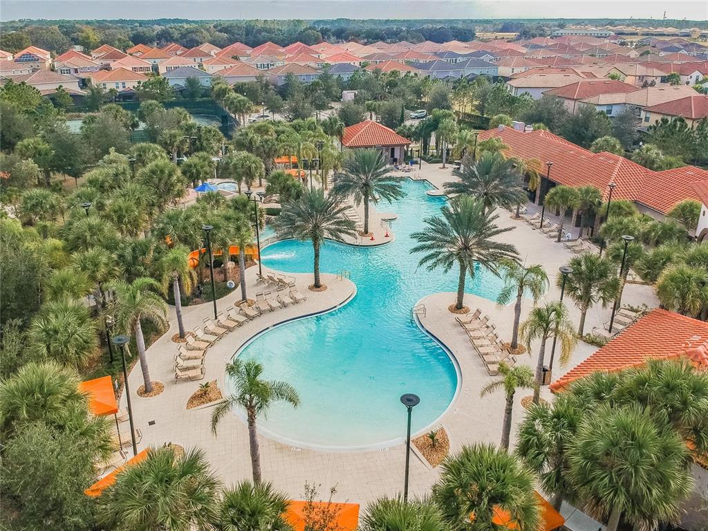 7196 Oakmoss Loop Davenport, FL 33837 - Photo 43 of 48 an aerial view of a house with a yard and lake view