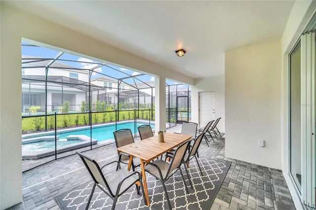 a view of a dining room with furniture window and outside view