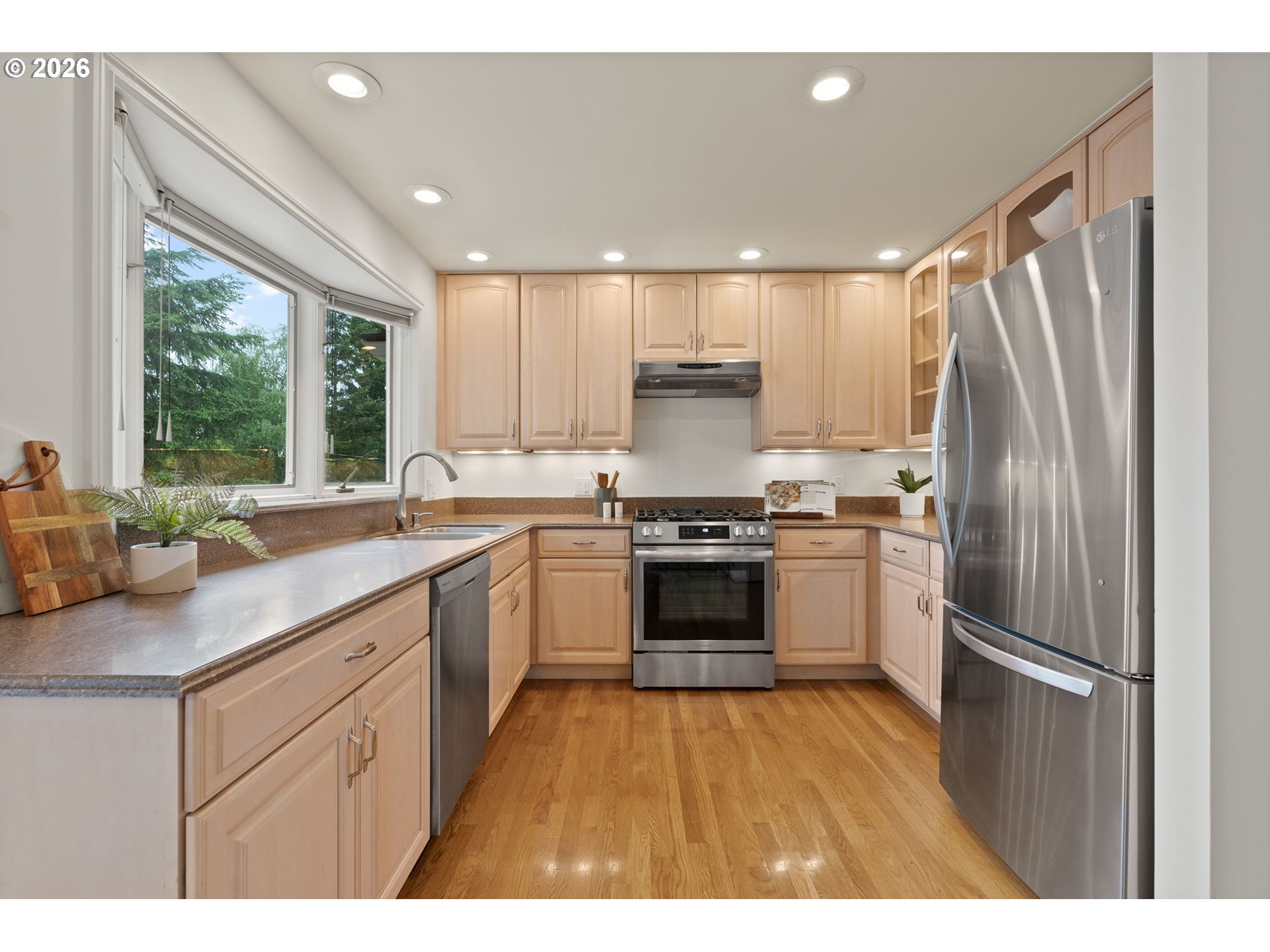 8120 Southwest Maple Drive Portland, OR 97225 - Photo 13 of 48 a kitchen with a refrigerator sink and stove