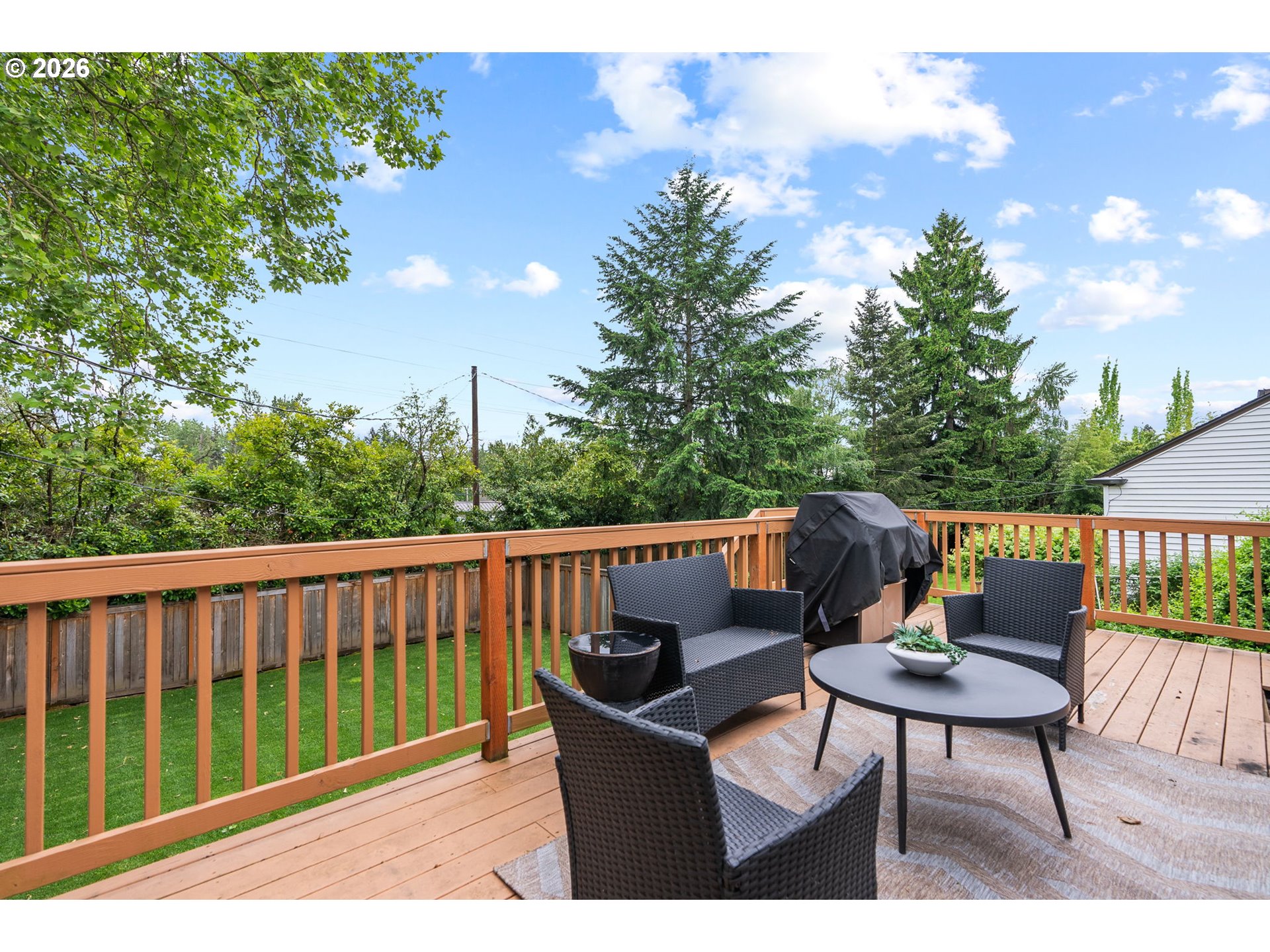 8120 Southwest Maple Drive Portland, OR 97225 - Photo 19 of 48 a balcony with wooden floor and outdoor seating