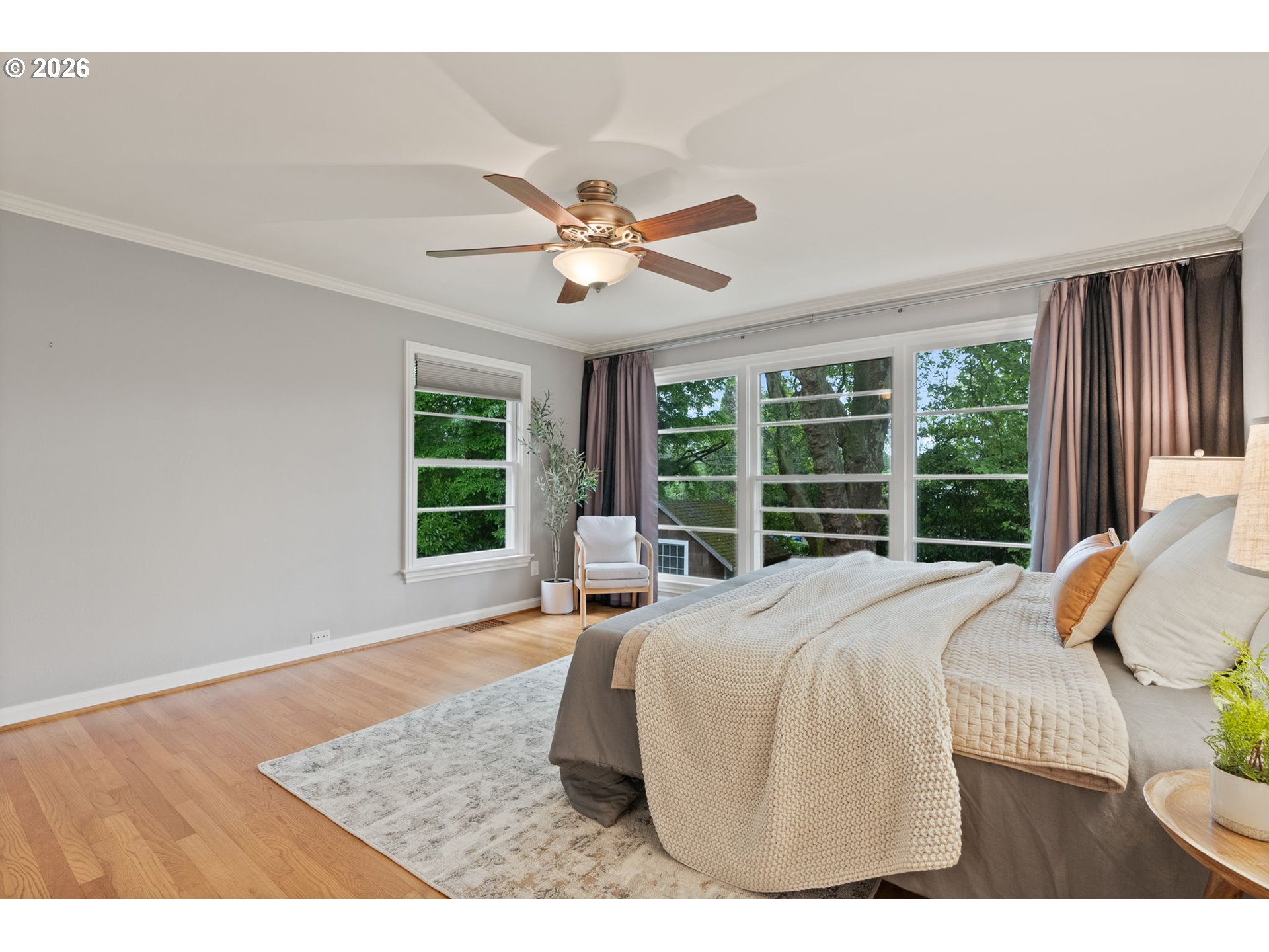 8120 Southwest Maple Drive Portland, OR 97225 - Photo 23 of 48 a bed sitting in a bedroom next to a window