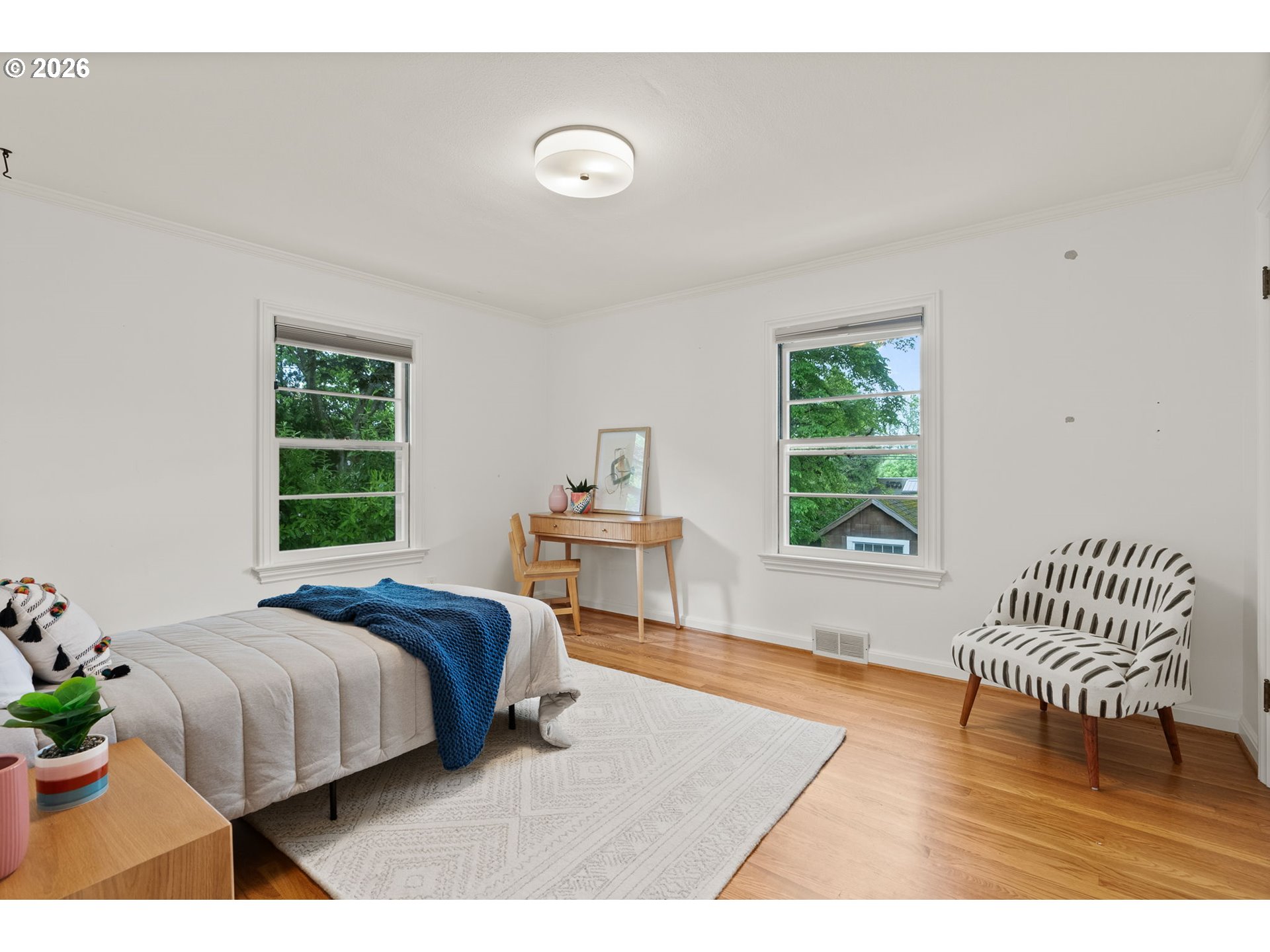 8120 Southwest Maple Drive Portland, OR 97225 - Photo 25 of 48 a bedroom with a bed and a table