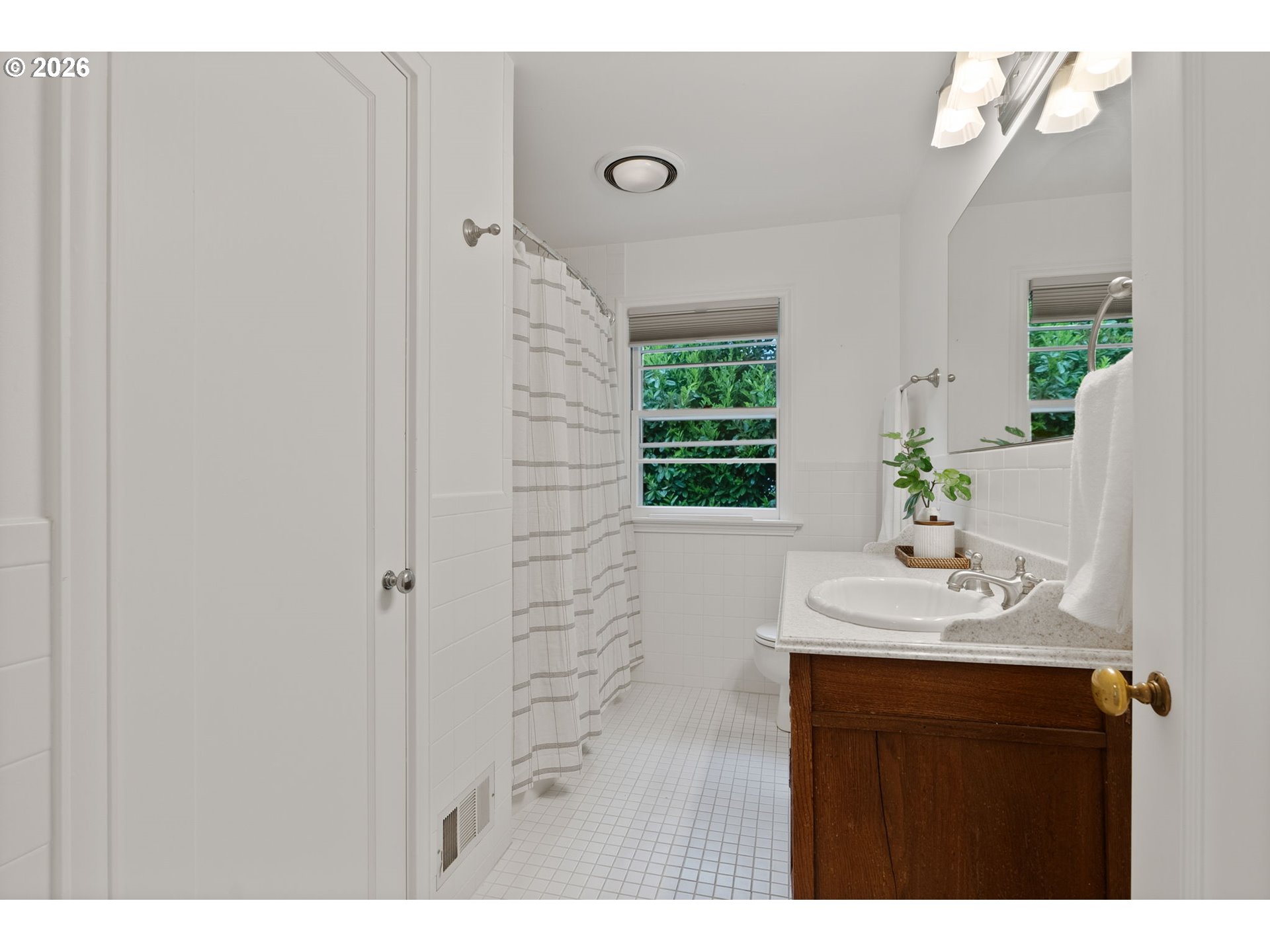 8120 Southwest Maple Drive Portland, OR 97225 - Photo 27 of 48 a bathroom with a sink and a mirror