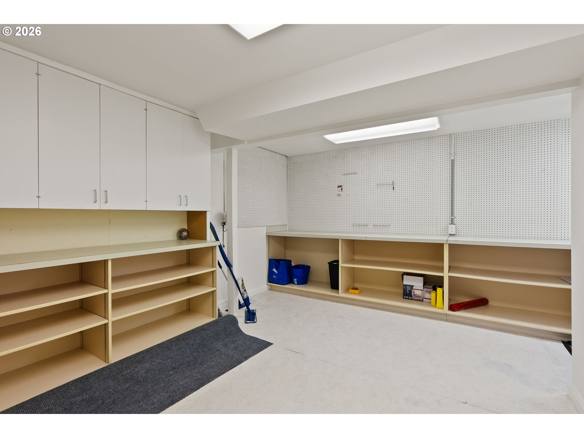 8120 Southwest Maple Drive Portland, OR 97225 - Photo 36 of 48 a living room with a flat screen tv cabinets and a ceiling fan