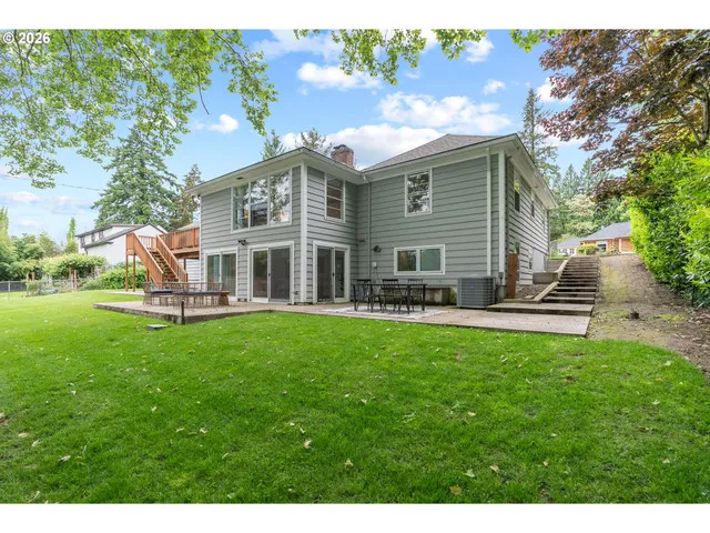 a view of a house with a yard porch and sitting area