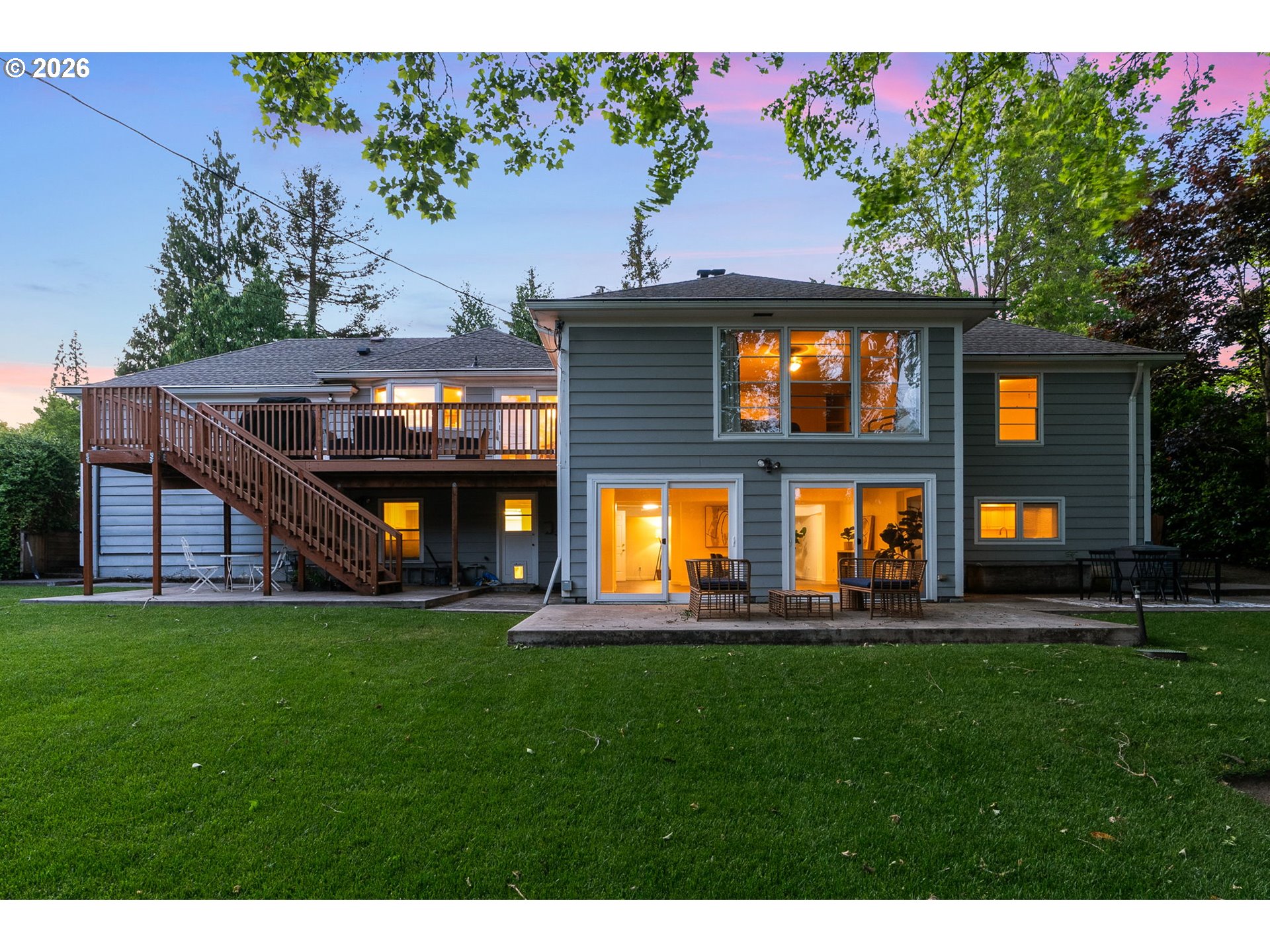 8120 Southwest Maple Drive Portland, OR 97225 - Photo 47 of 48 a view of a house with a yard and a tree
