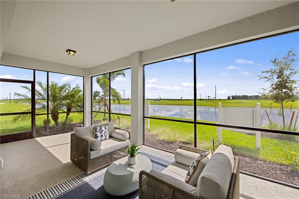 6008 Ellerston Way Avenue, Unit 1011 Immokalee, FL 34142 - Photo 19 of 50 Sunroom / solarium featuring an outdoor living space and a water view