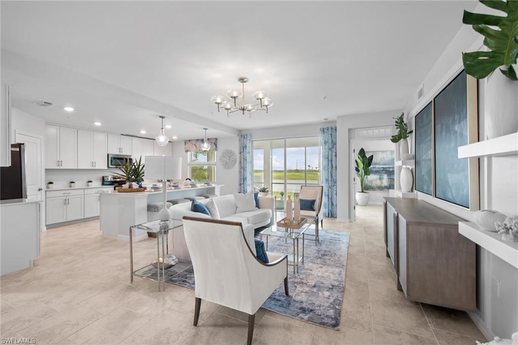 6008 Ellerston Way Avenue, Unit 1011 Immokalee, FL 34142 - Photo 4 of 50 Living room with recessed lighting, a chandelier, and light tile patterned floors