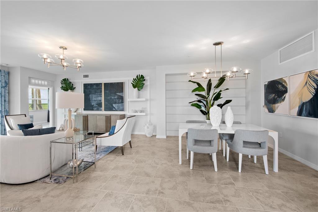 6008 Ellerston Way Avenue, Unit 1011 Immokalee, FL 34142 - Photo 7 of 50 Tiled living area with a chandelier and baseboards