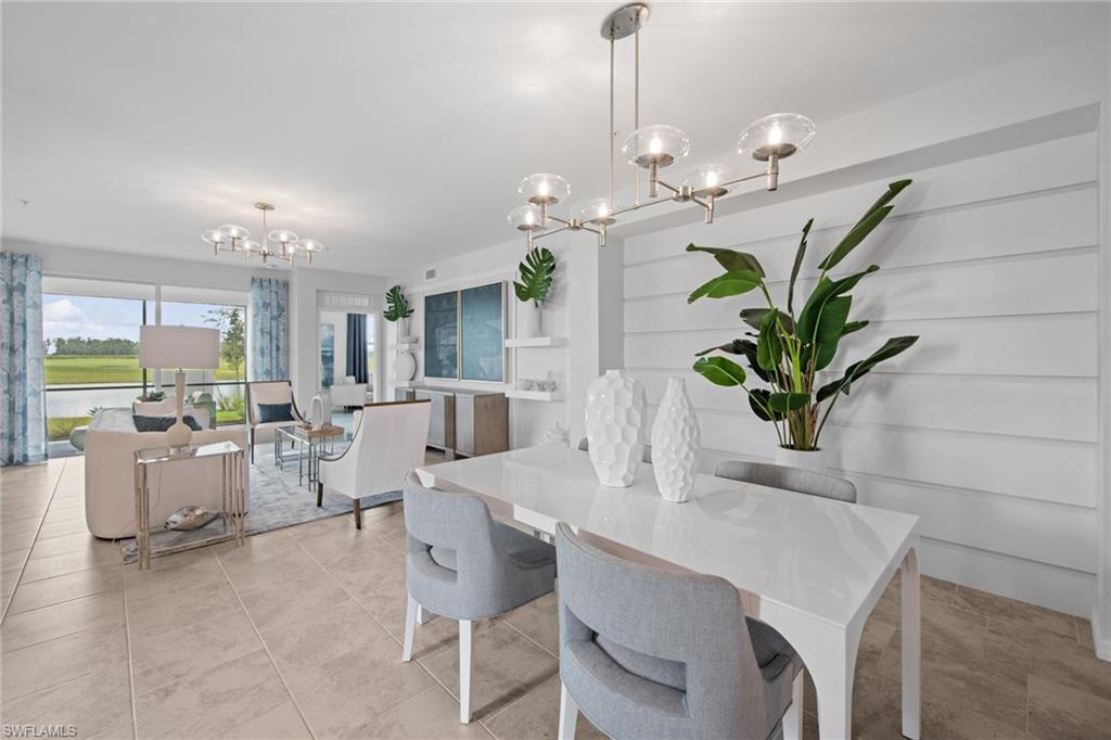 6008 Ellerston Way Avenue, Unit 1011 Immokalee, FL 34142 - Photo 9 of 50 Dining area with a chandelier and light tile patterned floors