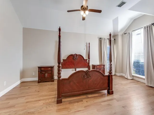 a living room with a bed furniture and a window