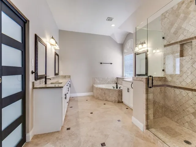 a bathroom with a double vanity sink mirror and double