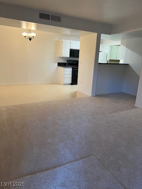 7885 West Flamingo Road, Unit 1064 Las Vegas, NV 89147 - Photo 10 of 19 Unfurnished living room with light colored carpet, baseboards, visible vents, and light tile patterned flooring