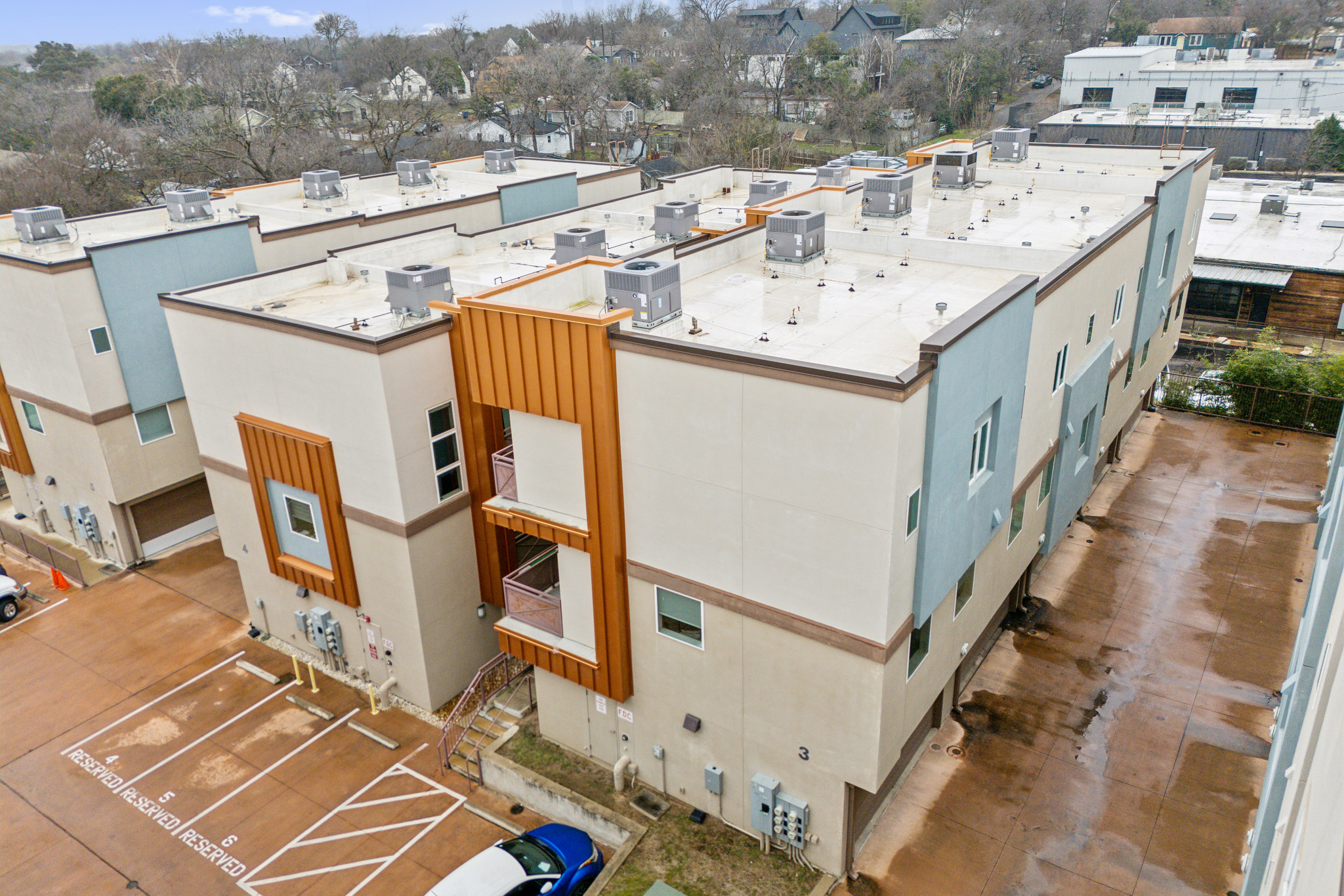 2827 Manor Road, Unit 3104 Austin, TX 78722 - Photo 23 of 30 Contemporary multi-unit complex featuring private balconies and designated parking.