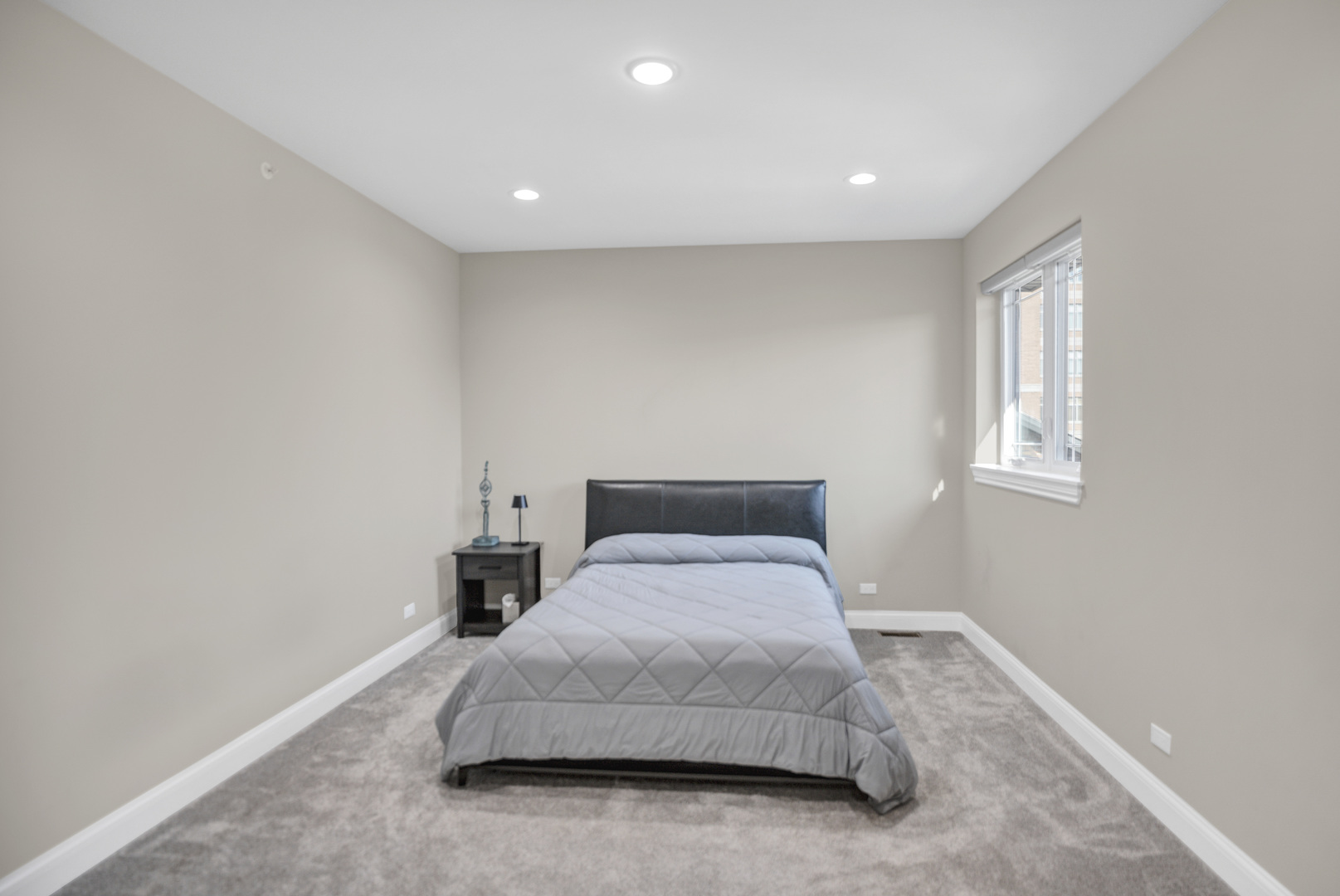 70 Prairie Court Wheeling, IL 60090 - Photo 19 of 44 a bedroom with a bed and window
