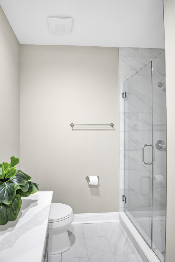 70 Prairie Court Wheeling, IL 60090 - Photo 26 of 44 a bathroom with a shower and a toilet