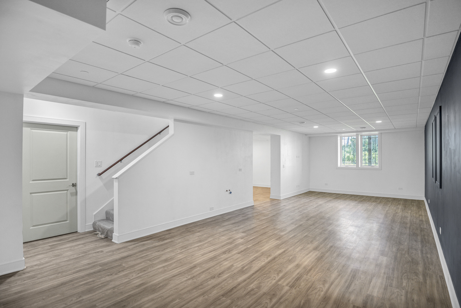 70 Prairie Court Wheeling, IL 60090 - Photo 32 of 44 an empty room with wooden floor and windows