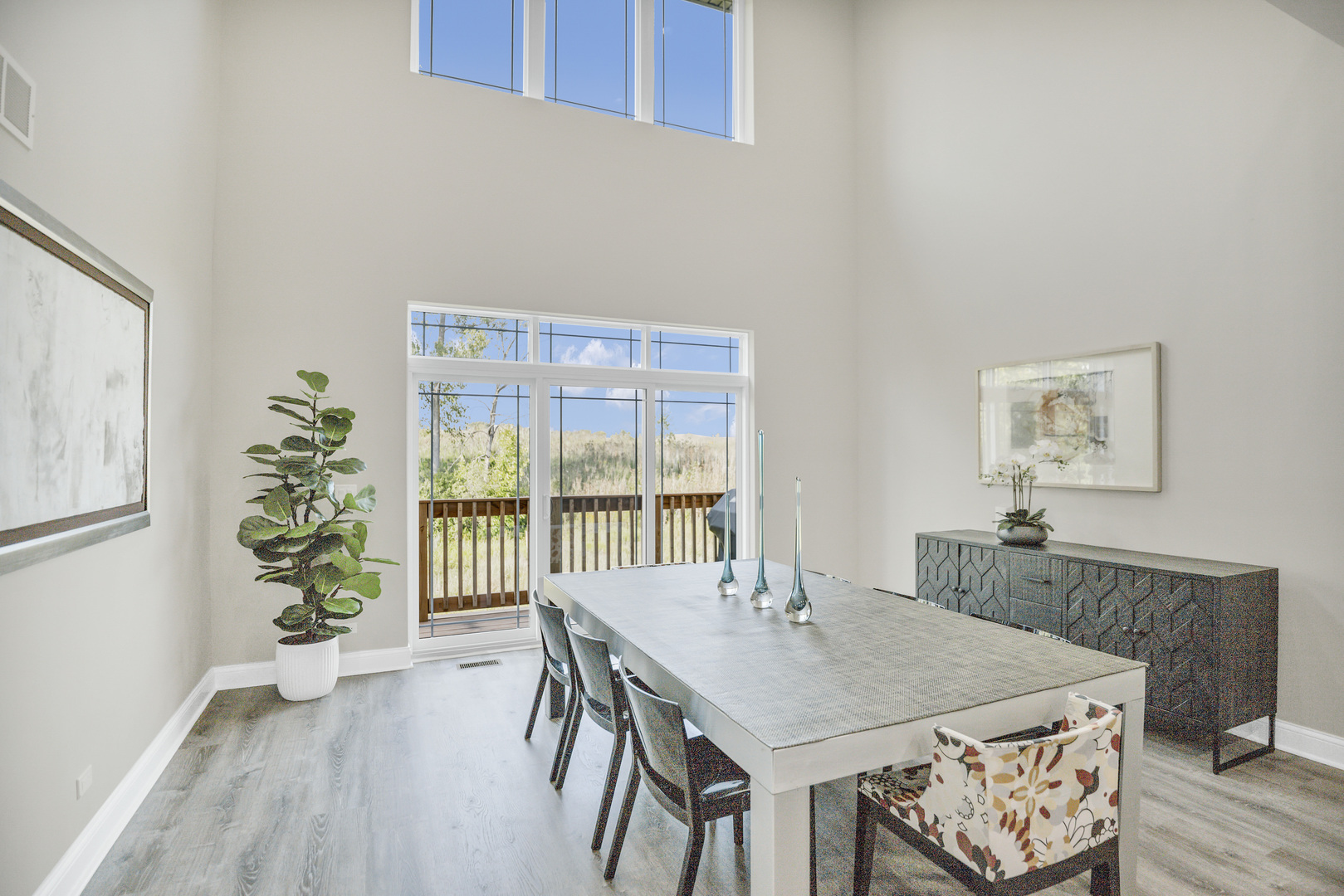 70 Prairie Court Wheeling, IL 60090 - Photo 9 of 44 a view of a dining room with furniture window and wooden floor
