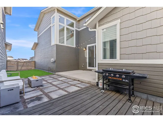 a view of a backyard with sitting area