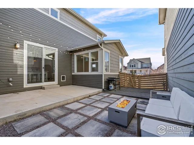 a backyard of a house with barbeque oven