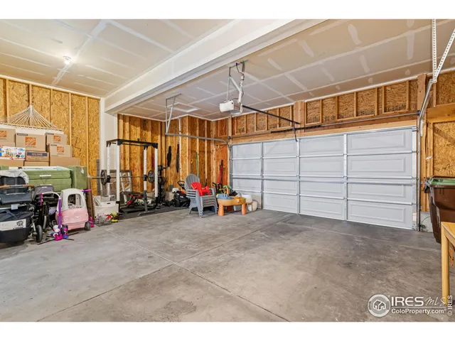 a view of a garage with parked cars