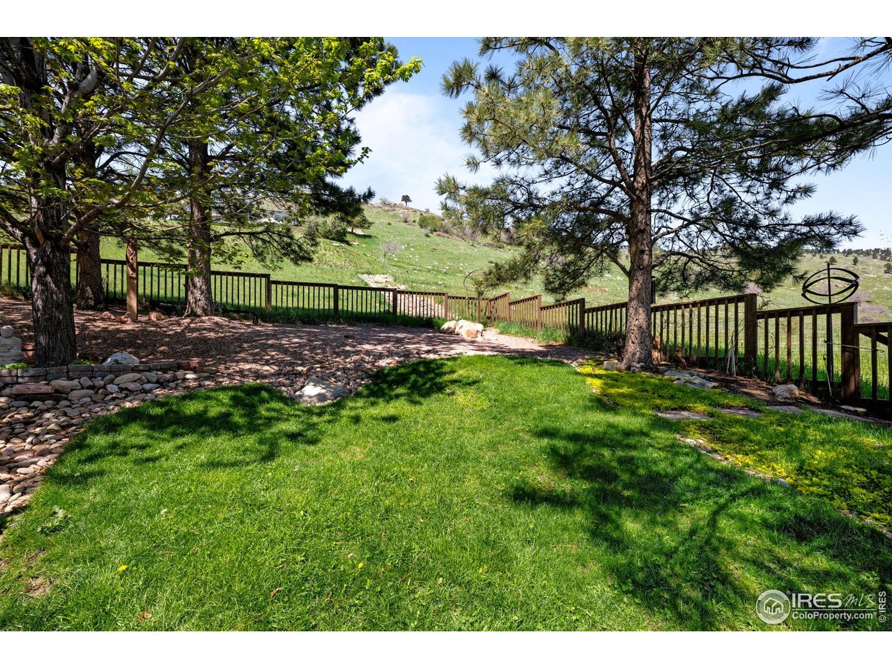 3945 Promontory Court Boulder, CO 80304 - Photo 17 of 33 a view of a backyard with wooden fence