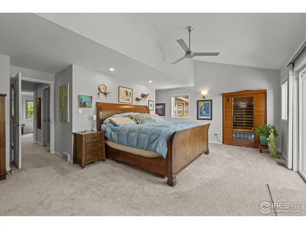 a bedroom with a bed and ceiling fan