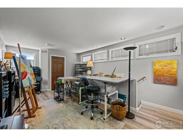 a workspace with furniture and a window