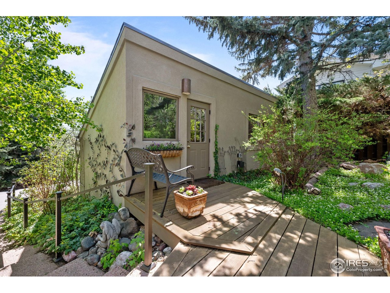 3945 Promontory Court Boulder, CO 80304 - Photo 32 of 33 a backyard of a house with table and chairs