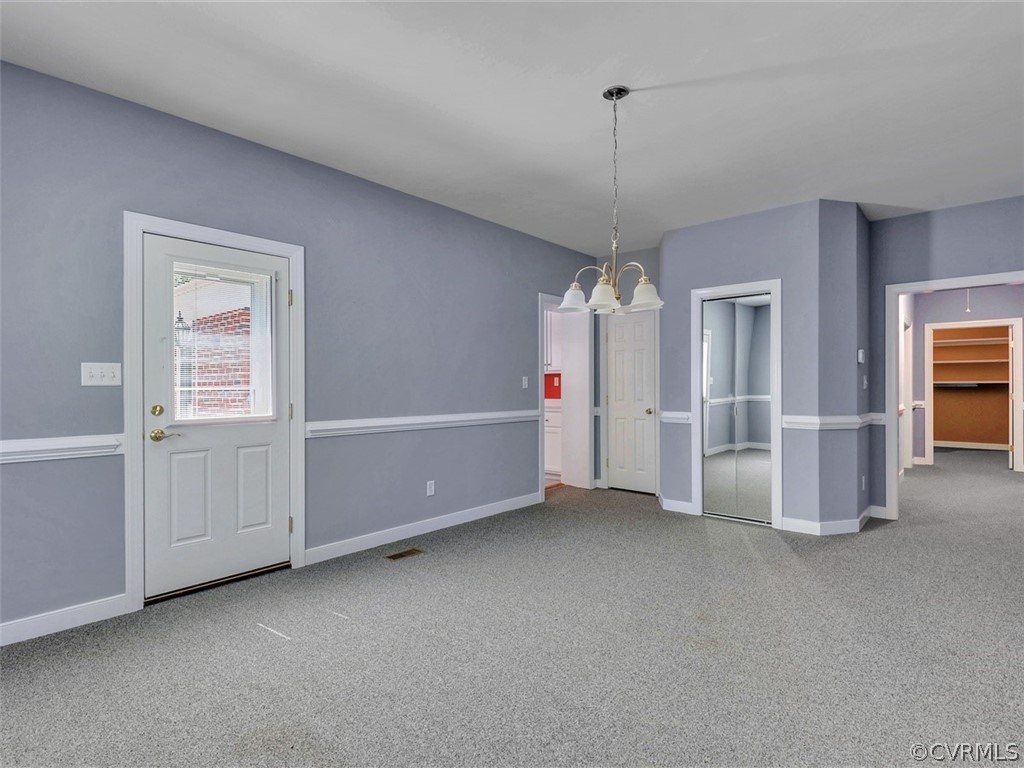 11311 Bundle Road Chesterfield, VA 23838 - Photo 11 of 38 a view of an empty room with chandelier