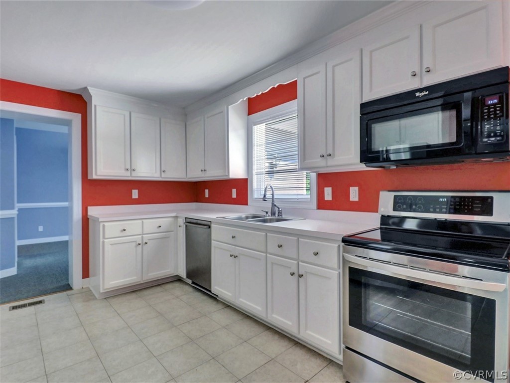11311 Bundle Road Chesterfield, VA 23838 - Photo 12 of 38 a kitchen with granite countertop cabinets stainless steel appliances and a sink