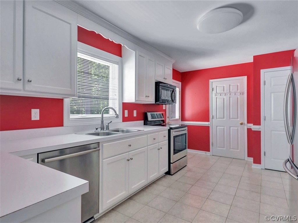 11311 Bundle Road Chesterfield, VA 23838 - Photo 14 of 38 a kitchen that has a sink and a stove in it
