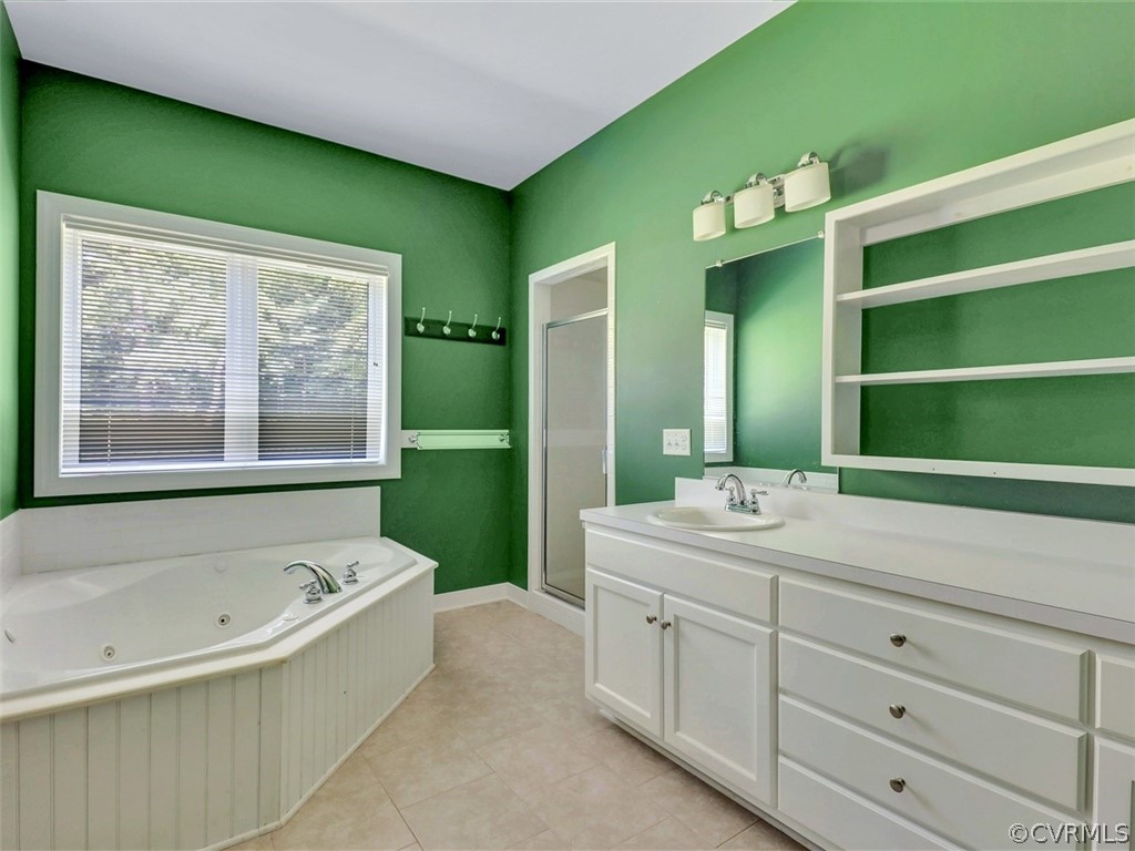 11311 Bundle Road Chesterfield, VA 23838 - Photo 18 of 38 a bathroom with a bathtub sink and mirror