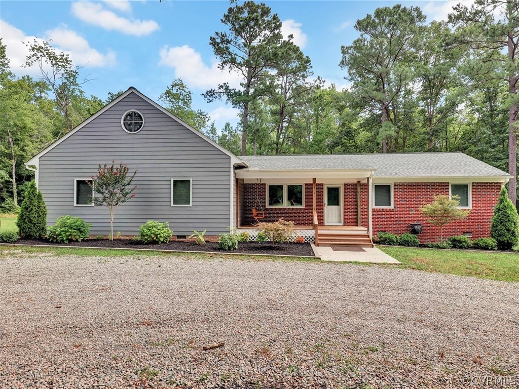11311 Bundle Road Chesterfield, VA 23838 - Photo 4 of 38 a front view of a house with a yard and porch