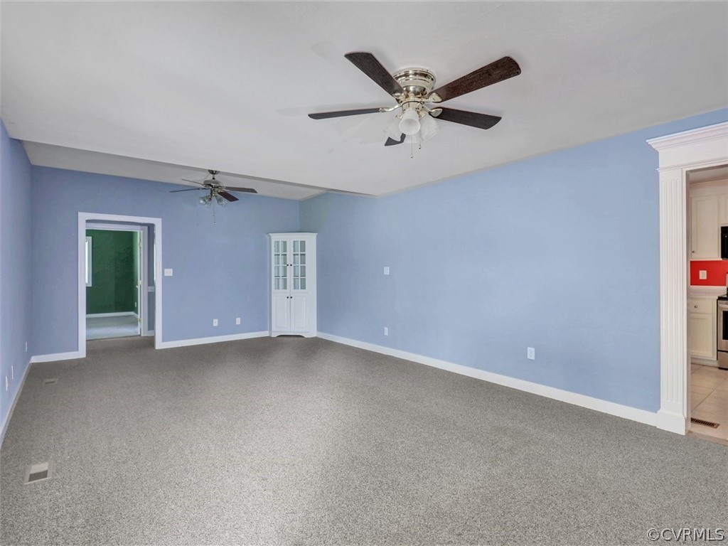 11311 Bundle Road Chesterfield, VA 23838 - Photo 7 of 38 an empty room with a ceiling fan and a window