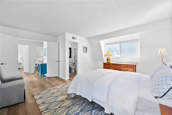 a bedroom with a bed and a couch