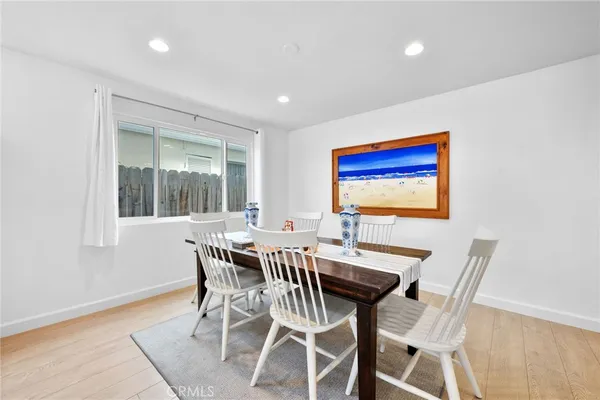 a view of a dining room with furniture and window