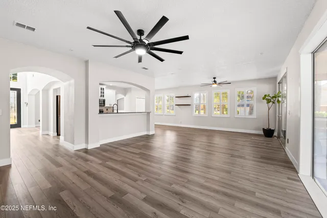 a kitchen with stainless steel appliances granite countertop wooden cabinets stove top oven and sink