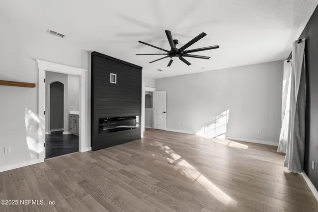 a bathroom with a sink vanity and mirror